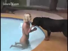 While swimming in nature's attire with her dog, the wife indulges in a little beastiality.